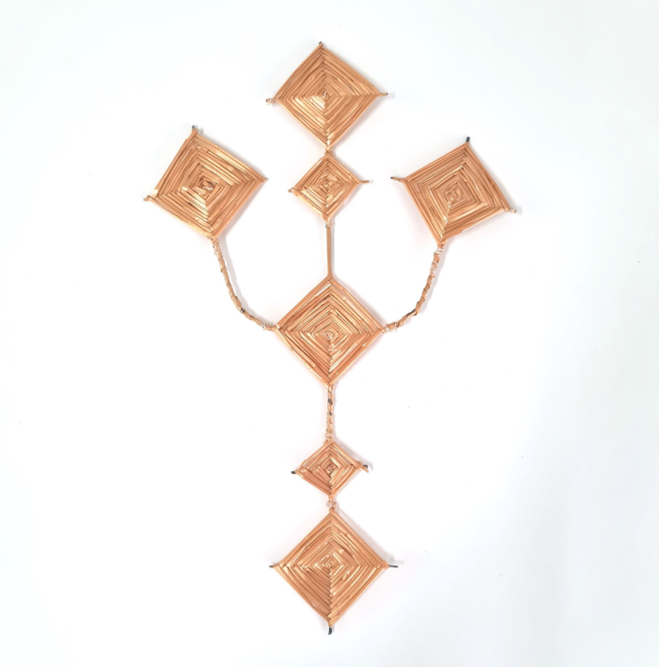 A Saint Brigid's Cross. The cross is shaped like a trident, with core areas that are shaped like diamonds.