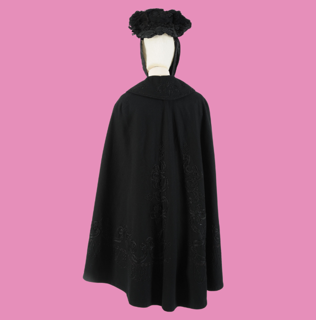 Black cape on a pink background