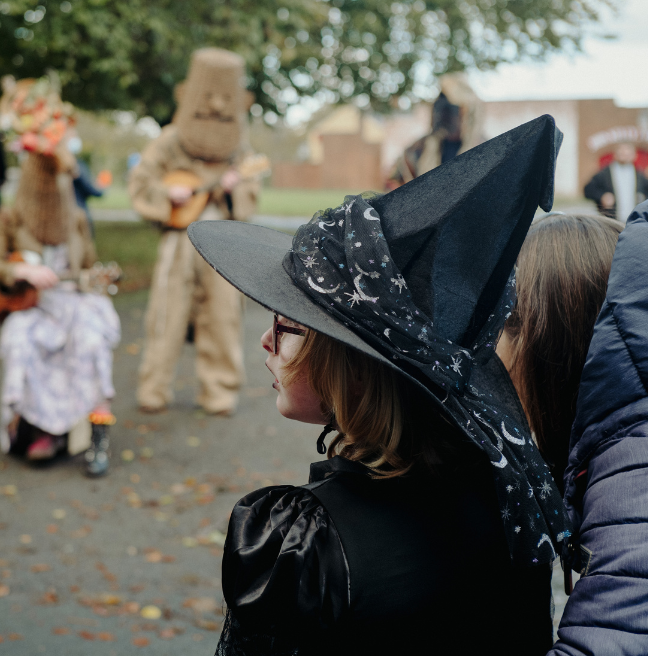 A child dressed as a witch