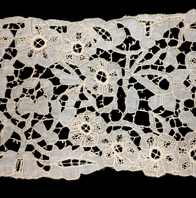 A close up image of Carrickmacross lace, with flower patterns.