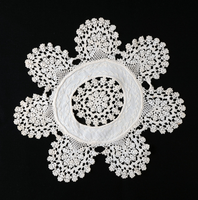 A crochet lace doily, with lots of small links.