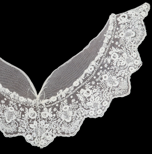 A v-shaped collar with intricate floral designs.