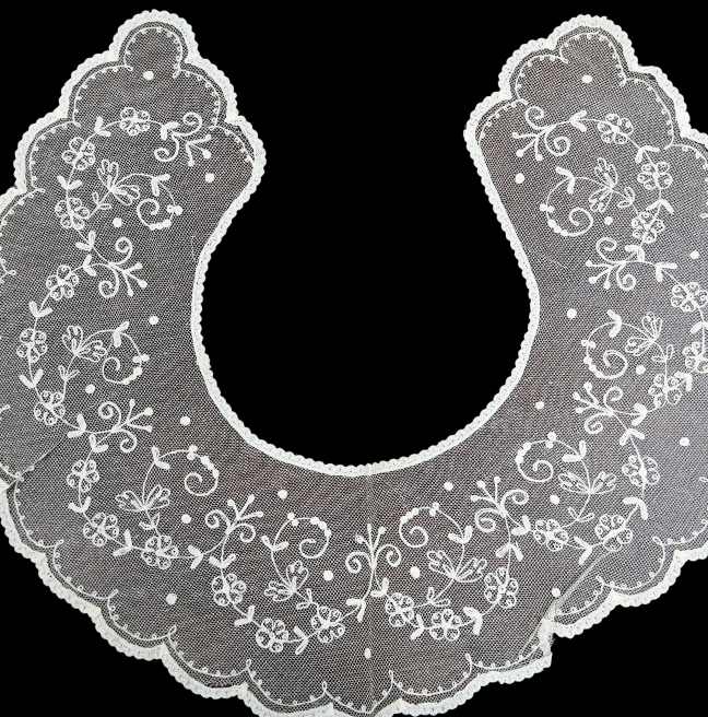 A c-shaped collar with delicate floral designs.