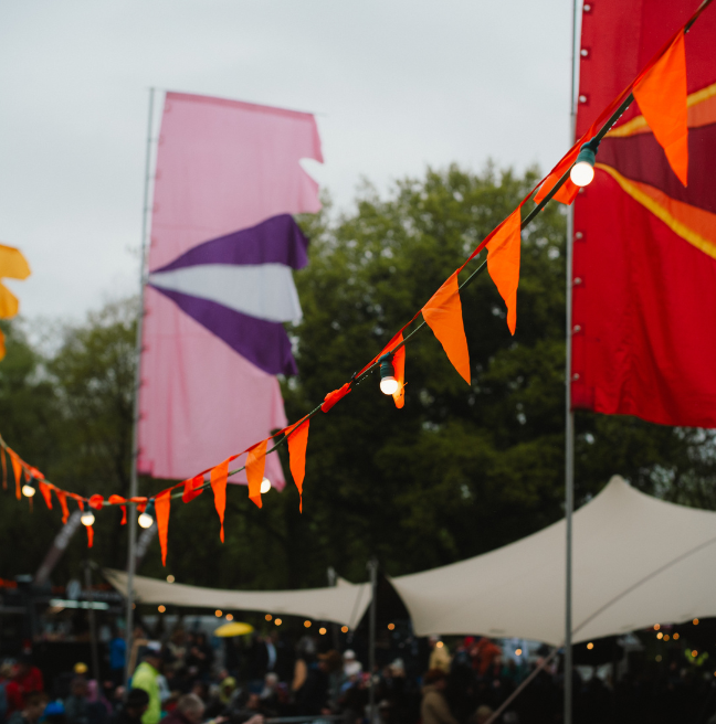 festival flags in orange pink and red