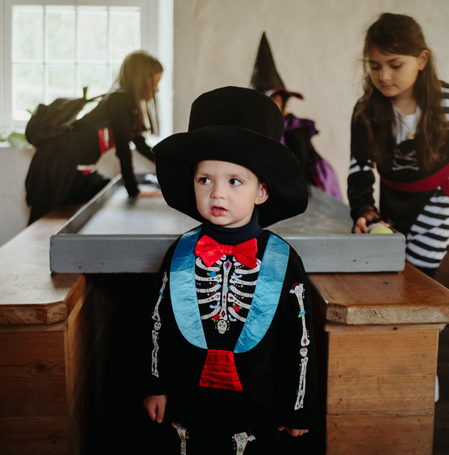 A child dressed in costume at halloween