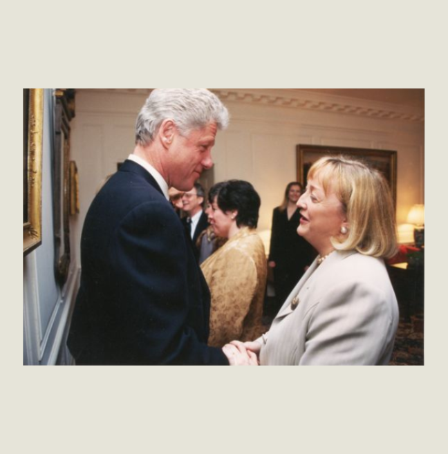 U.S President Bill Clinton shaking the hand of Monica McWilliams