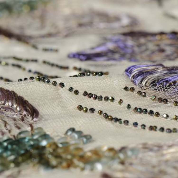 Detail of beading and embroidery on train
