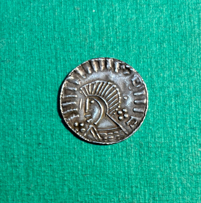 a silver coin, courtesy of Dr. John Rainey