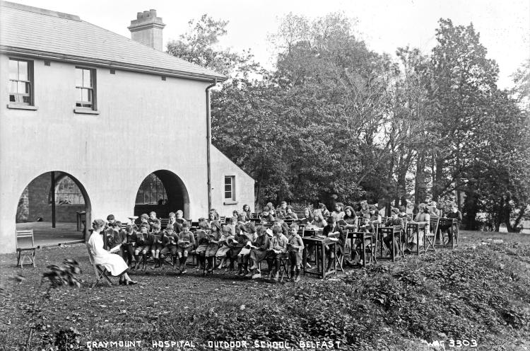A black and white photograph of an outdoor school.