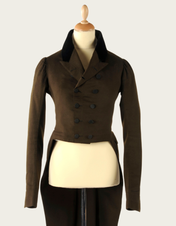 A men's green coat dating from the late 1700s to early 1800s.