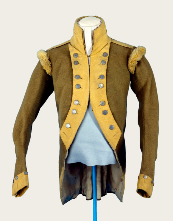 A men's green coat with yellow trim, dating from the late 1700s to early 1800s.