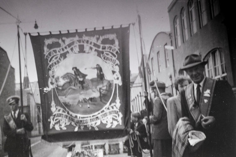 A black and white image of an Orange Order march.