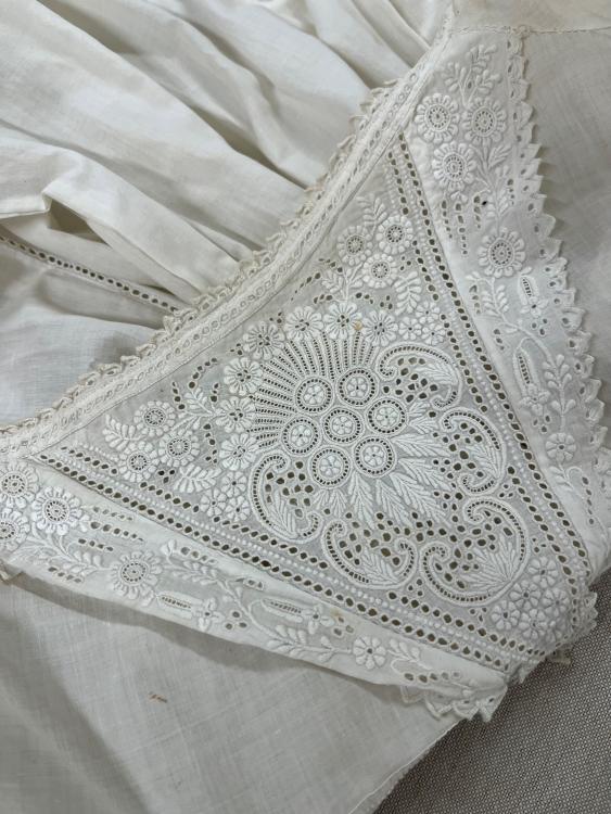 Detail on the yoke of a white christening robe from the late 1800s