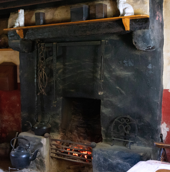 A large stone fireplace.