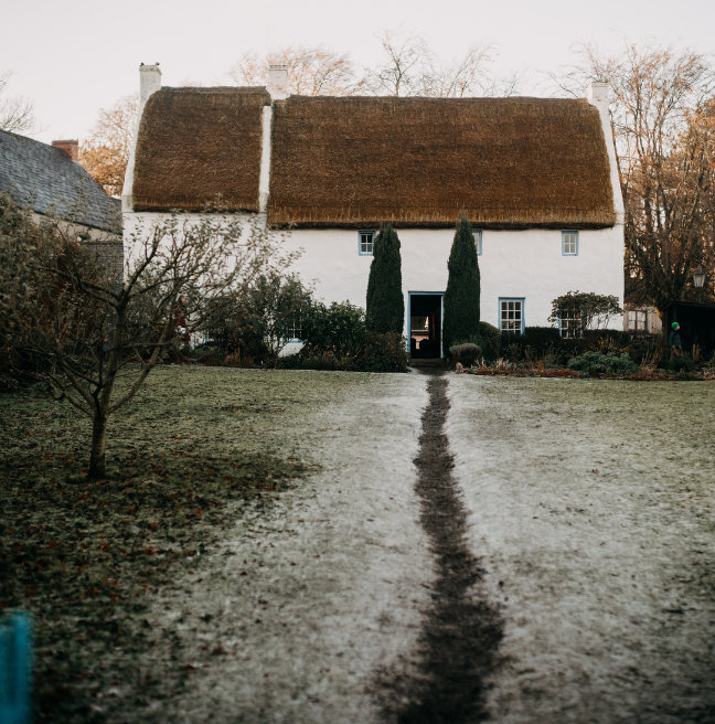 A wintery day with icy grass leading to the Rectory 