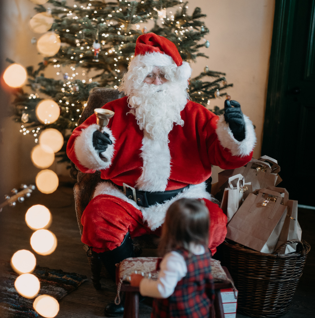 Santa clause and a small child