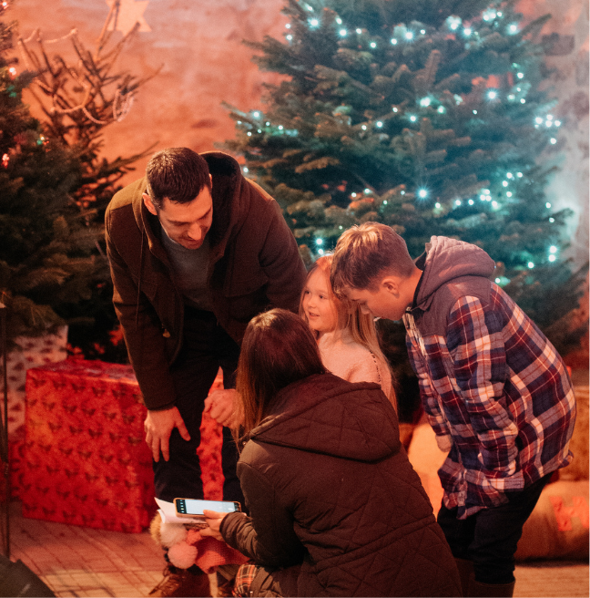 A family waiting to see father christmas