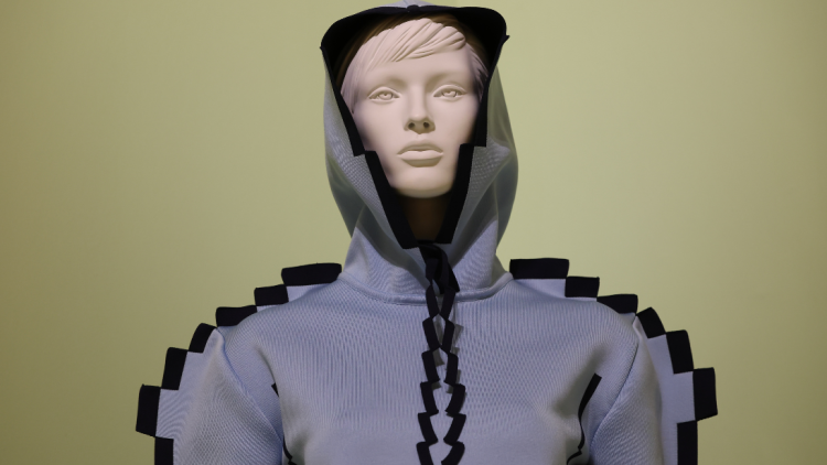A close up of a white mannequin with a face, modelling the blue and black Pixelated hoodie from Loewe's Spring/Summer 2023 collection