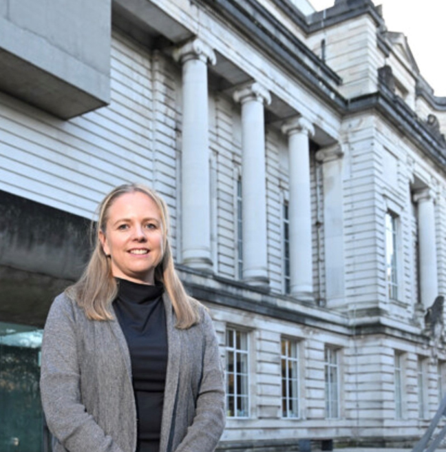 A woman stands outside of the Ulster Museum.