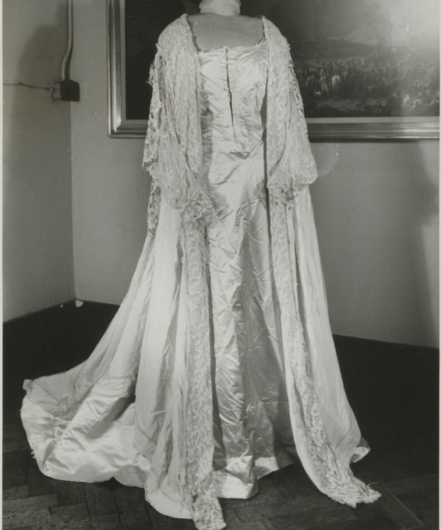 A black and white photograph of a long evening wrap