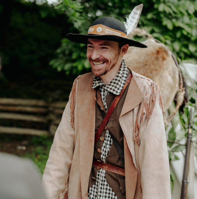 A male costumed guide at the Ulster American Folk Park. He's dressed in indigenous clothes from the time of American Independence 250 years ago.
