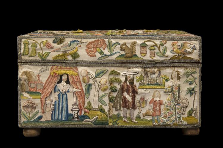 The side of an embroidered box. On the boyyom left a woman parts her curtains, her maid behind her. On the left a man greets a child with a jug and a woman in an embroided floral dress.