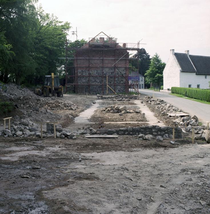 The foundations newly lain of a row of houses.