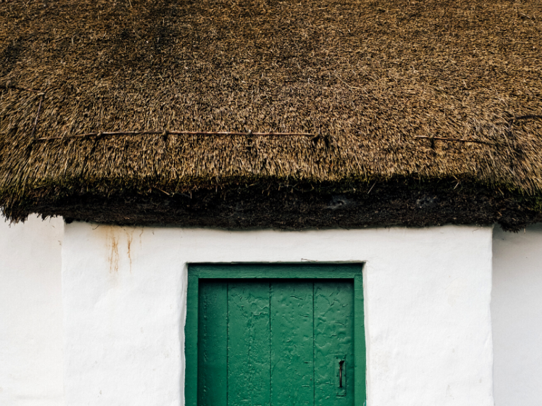 Thatch roof and green door 