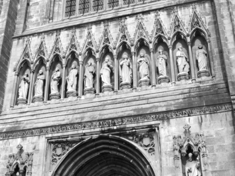 Black and white photograph of the sculptures outside the St. Patricks Cathedral in Armagh