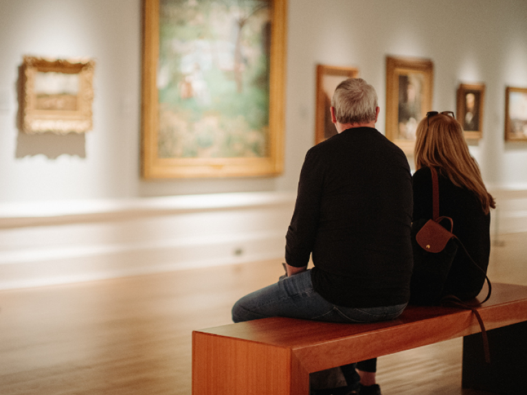 two people looking at the art a the ulster museum 