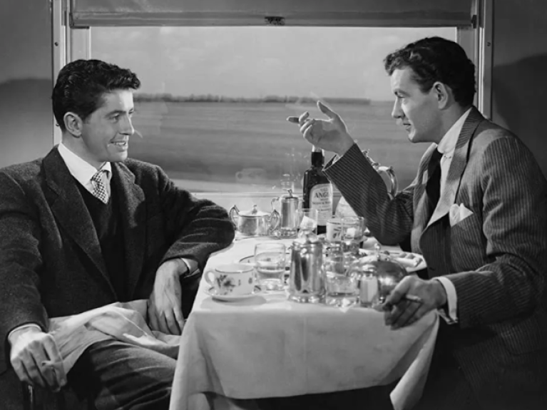 Strangers on a train black and white image of 2 men