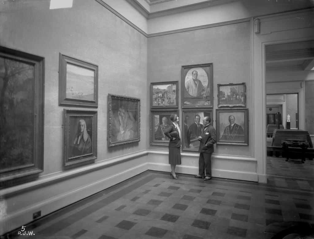 Sir John and Lady Lavery standing in Ulster Museum.