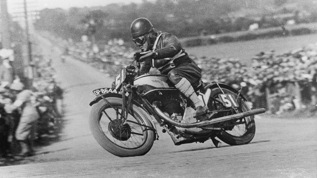 Black and white photograph of Stanley Woods racing