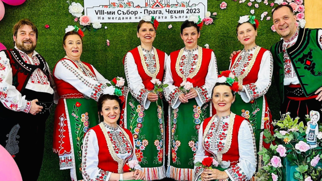 Bulgarian newcomers dressed in red, green, black and white traditional dress