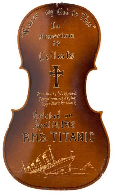 The back of a cello that has been dedicated to the cellists who died on the Titanic. It features their names and artwork of a Christian cross.