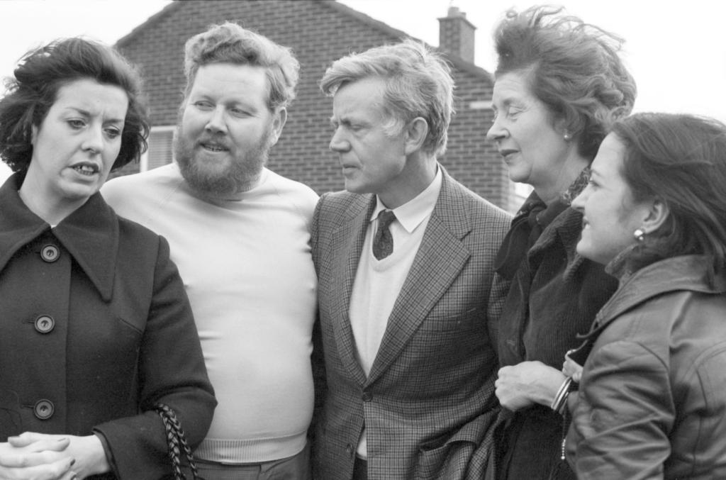 Photograph of Mairead Corrigan, Betty and Ralph Williams, Senator Thompson and Lady Fisher taken outside in a residential street.
