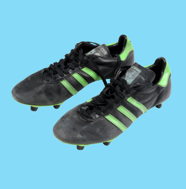 Black and green stripe football boots that belonged to George Best