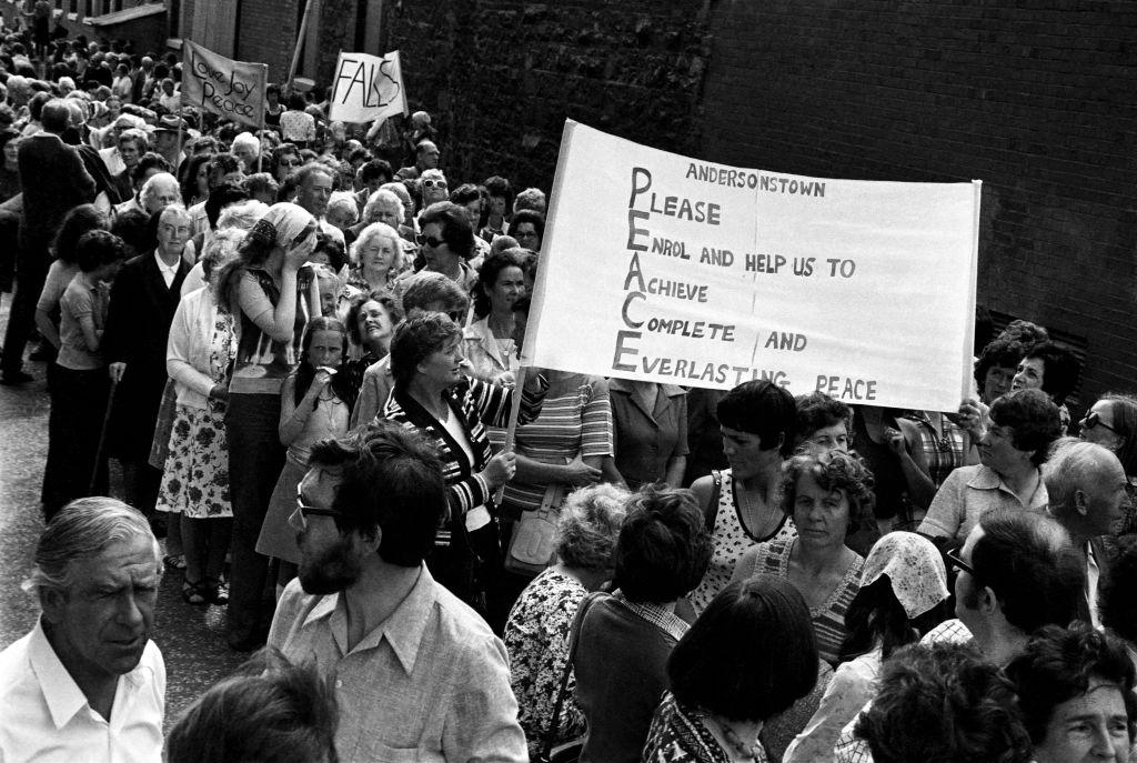A black and white photograph of a peace march.