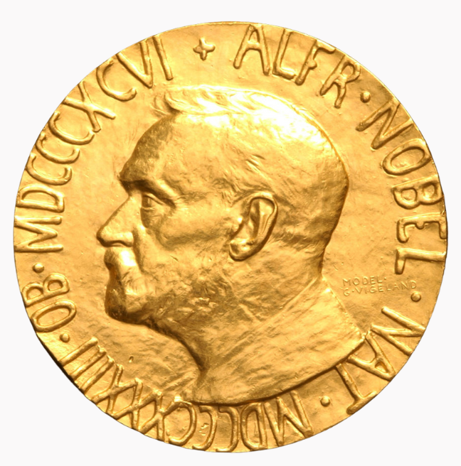 A Nobel medal, a gold disc with Alfred Nobel on it in relief. 