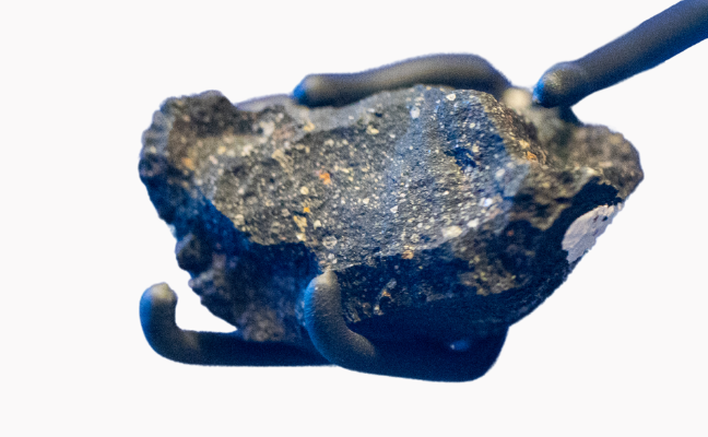 A small meteorite. It looks like a speckled stone.