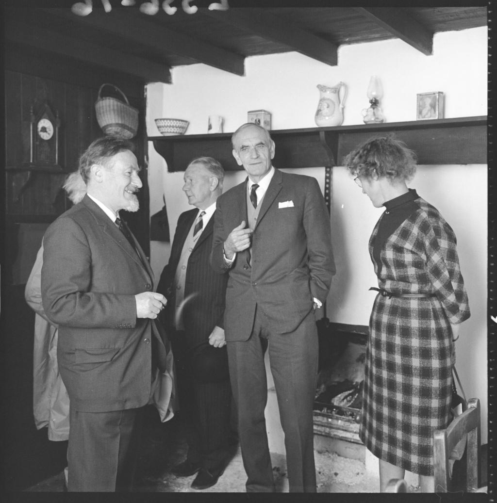 Prof E.E. Evans, Angus McDonald, Mrs Harris in interior group