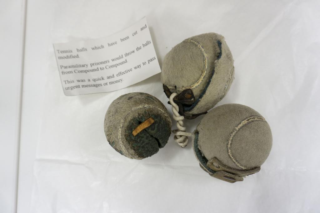 Tennis balls and label description in the Prison Service Collection